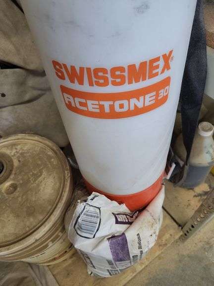 Assorted Construction Materials: Sand, Acetone, and Form Oil