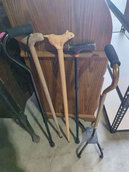 Variety of Walking Canes with Carved Details and Adjustable Models