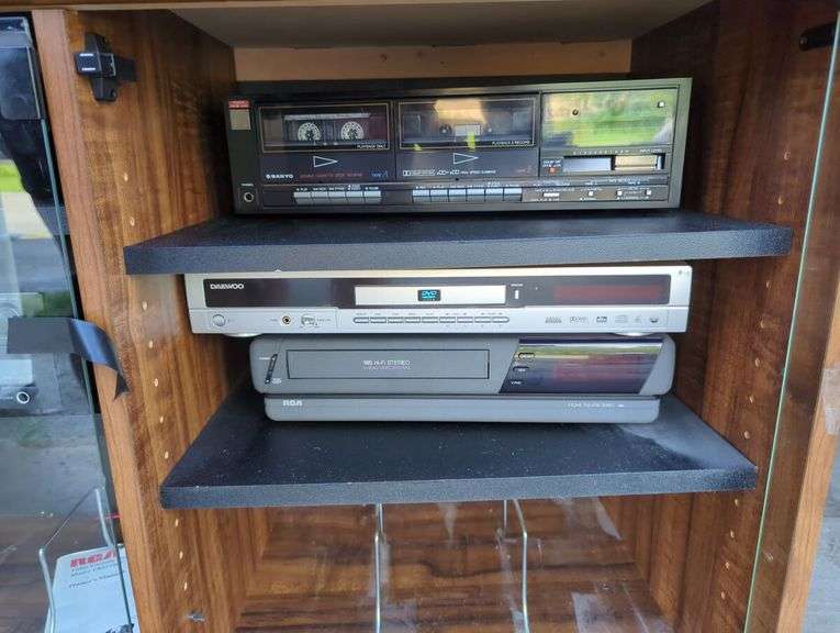 Entertainment Center with Kenwood Receiver, Sony CD Changer, Sanyo Cassette Deck, Daewoo DVD Player and RCA VHS Player