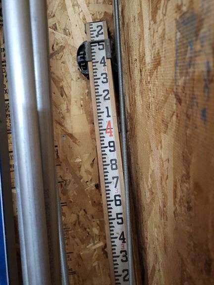 Building and Construction Tool Lot: Empire Level, Conduit, Measuring Stick, and More