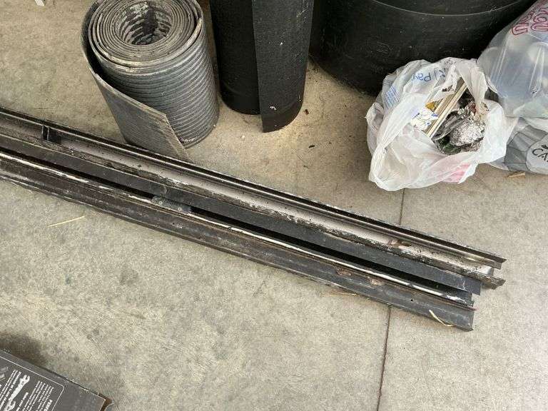 Heavy aluminum castings and rolls of rubber.