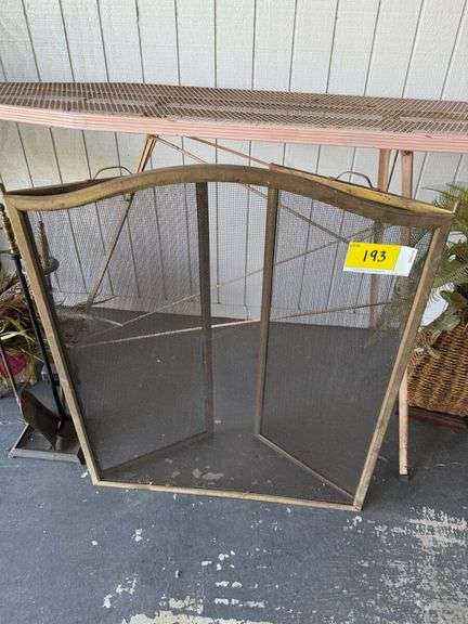 Fireplace Screen with Tools, Decorative Floral Arrangements, and Ironing Board