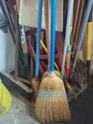 Collection of Brooms, Rakes, Shovels, and Cleaning Tools