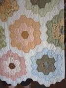 Handmade Quilt with Floral Hexagon Pattern