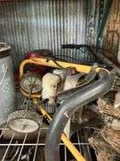Shelf of Various Items - Coolant Reservoir, Hydraulic Fluid, Wheeled Machine