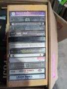 Boxes of Media and Books: Cassettes, VHS Tapes, DVDs, and Assorted Books