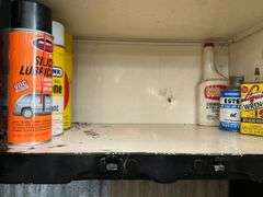Garage Cabinet of Supplies - Caulking, Cleaners, Lubricants, Repair Items