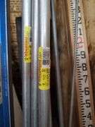 Building and Construction Tool Lot: Empire Level, Conduit, Measuring Stick, and More