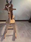 Potted Plants and Wooden Rocking Horse