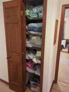 contents of Linen Cabinet with Linens and towels