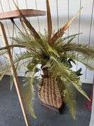Fireplace Screen with Tools, Decorative Floral Arrangements, and Ironing Board