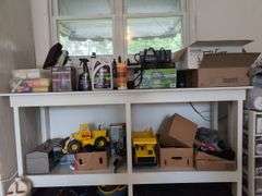 Contents of workbench, barn, lantern, ground clear, air station, toolbox, Tonka trucks, and more