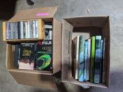 Boxes of Media and Books: Cassettes, VHS Tapes, DVDs, and Assorted Books