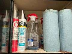 Garage Cabinet of Supplies - Caulking, Cleaners, Lubricants, Repair Items