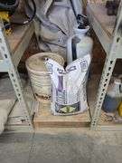 Assorted Construction Materials: Sand, Acetone, and Form Oil