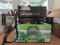 Contents of workbench, barn, lantern, ground clear, air station, toolbox, Tonka trucks, and more