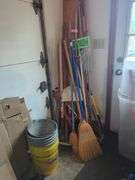 Collection of Brooms, Rakes, Shovels, and Cleaning Tools