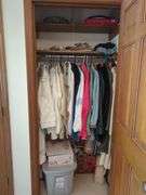 Assorted Closet Items: Clothing, Storage, and Collectibles