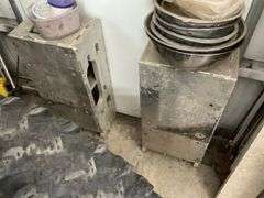 Heavy aluminum castings and rolls of rubber.