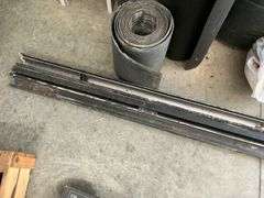 Heavy aluminum castings and rolls of rubber.