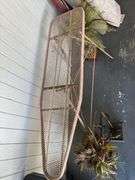 Fireplace Screen with Tools, Decorative Floral Arrangements, and Ironing Board
