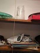 Assorted Closet Items: Clothing, Storage, and Collectibles