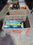 Boxes of Media and Books: Cassettes, VHS Tapes, DVDs, and Assorted Books