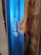 Building and Construction Tool Lot: Empire Level, Conduit, Measuring Stick, and More