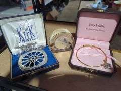 Kirk Pewter Necklace, 1973 Canadian Dollar Display, and Juicy Couture Bracelet