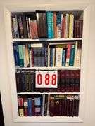 Bookshelf Collection of Various Books and Reference Materials