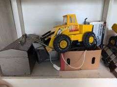 Contents of workbench, barn, lantern, ground clear, air station, toolbox, Tonka trucks, and more