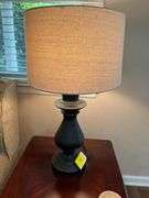 Lamp, Iron Cross and Basket of Books