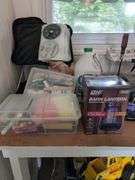 Contents of workbench, barn, lantern, ground clear, air station, toolbox, Tonka trucks, and more
