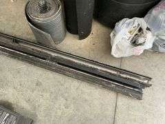 Heavy aluminum castings and rolls of rubber.
