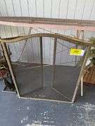 Fireplace Screen with Tools, Decorative Floral Arrangements, and Ironing Board