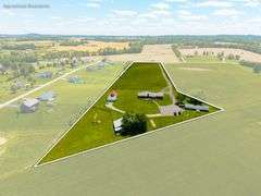 AUCTION! TWO HOMES • FINISHED METAL BUILDING (BARNDOMINIUM) • 70'x40' BARN • 9± ACRES