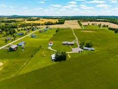 AUCTION! TWO HOMES • FINISHED METAL BUILDING (BARNDOMINIUM) • 70'x40' BARN • 9± ACRES