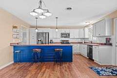 AUCTION! TWO HOMES • FINISHED METAL BUILDING (BARNDOMINIUM) • 70'x40' BARN • 9± ACRES